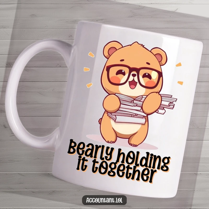 Funny bear office mug, a tiny bear wearing glasses, precariously balancing tall stacks of papers with a determined look.