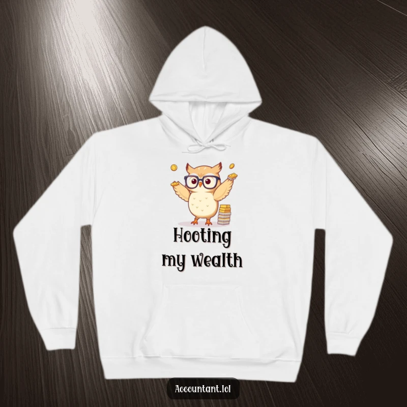 Funny hoodie design with a small, spectacled owl skillfully juggling piles of paper coins, offering warm financial wisdom and humor.